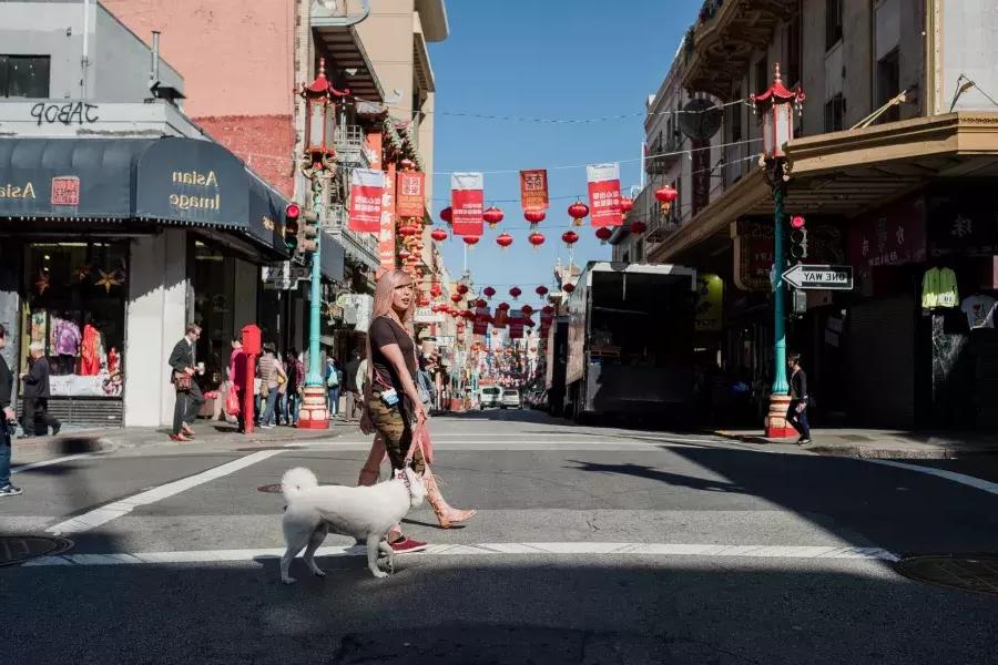 Nya Cruz walking with her dog in Chinatown.